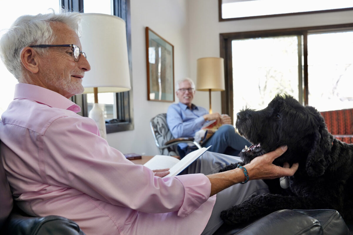 Timm scratching Shylo's chin while Curt looks on